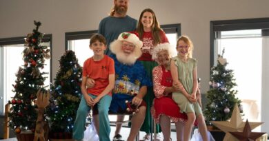 A family poses with Santa.