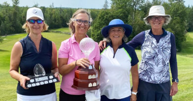 Greensmere club champions crowned over weekend Four people pose with trophies.