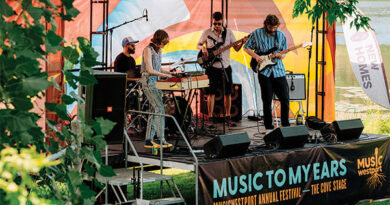A band plays on a stage.