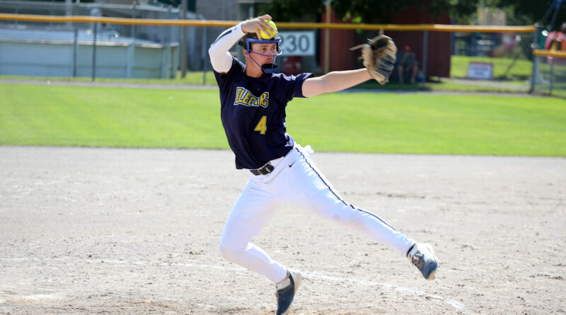 A man pitches a ball.